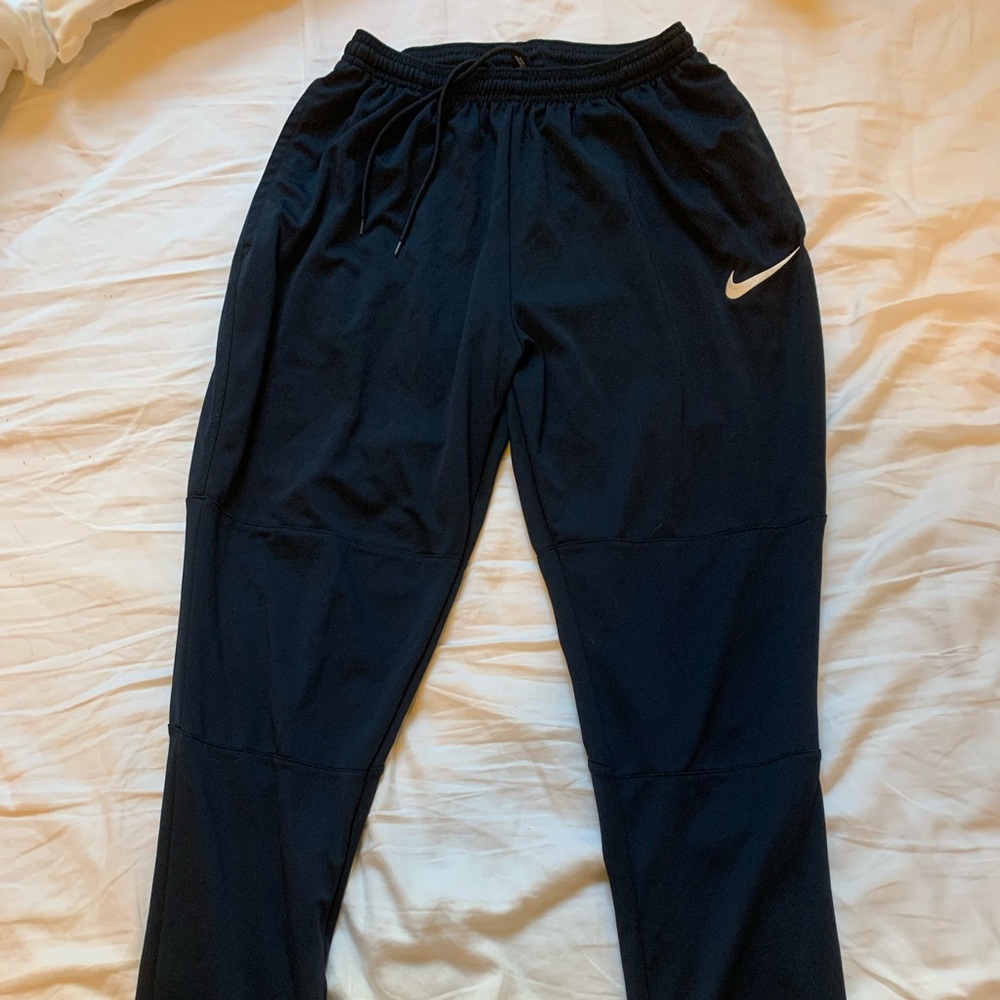 Dark blue Nike Men's Dri-FIT Essential Woven Pocket Running Pants size L.